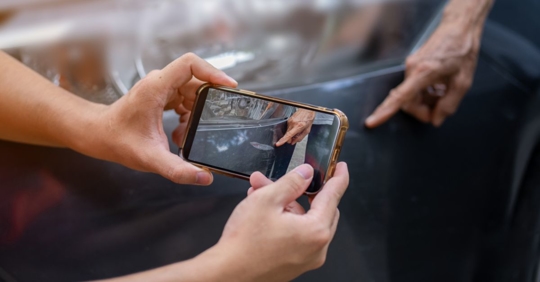Taking photo of car accident