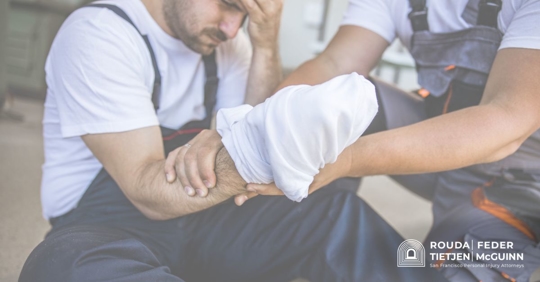 worker with a makeshift bandage over hand