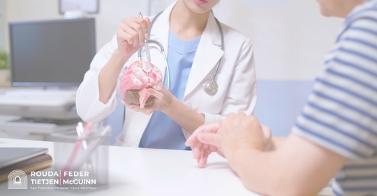 doctor showing patient a brain model