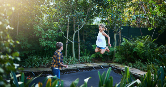 Children playing on trampoline