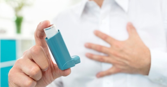 Doctor holding an inhaler