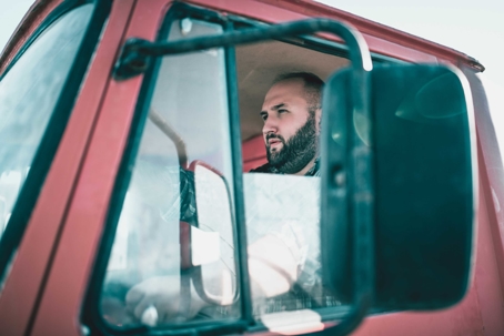 Truck driver in cab of a truck